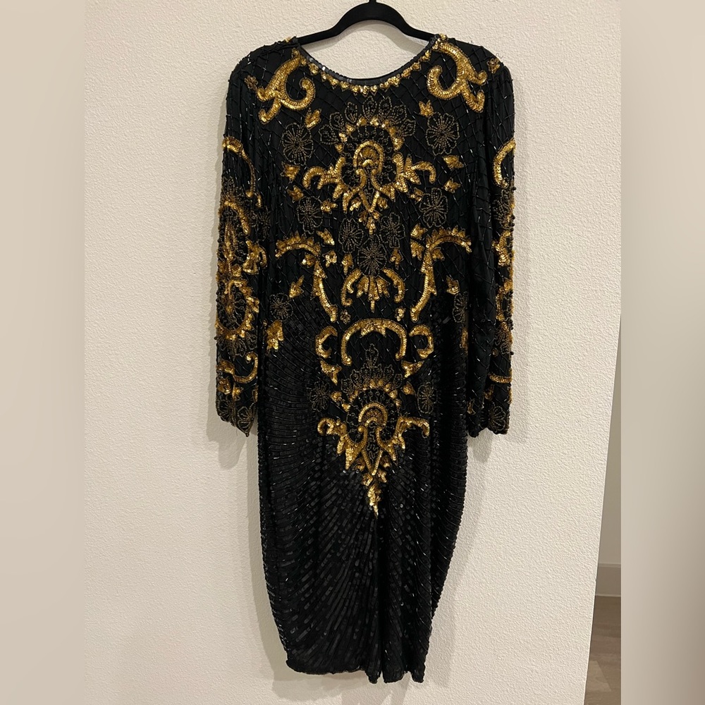 Stunning black and gold beaded dress perfect for holiday parties!